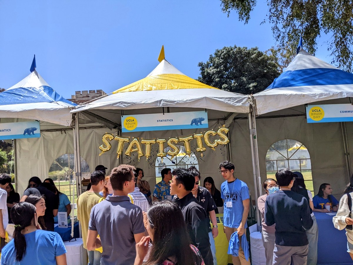 Students gather at the UCLA Statistics booth during a campus event